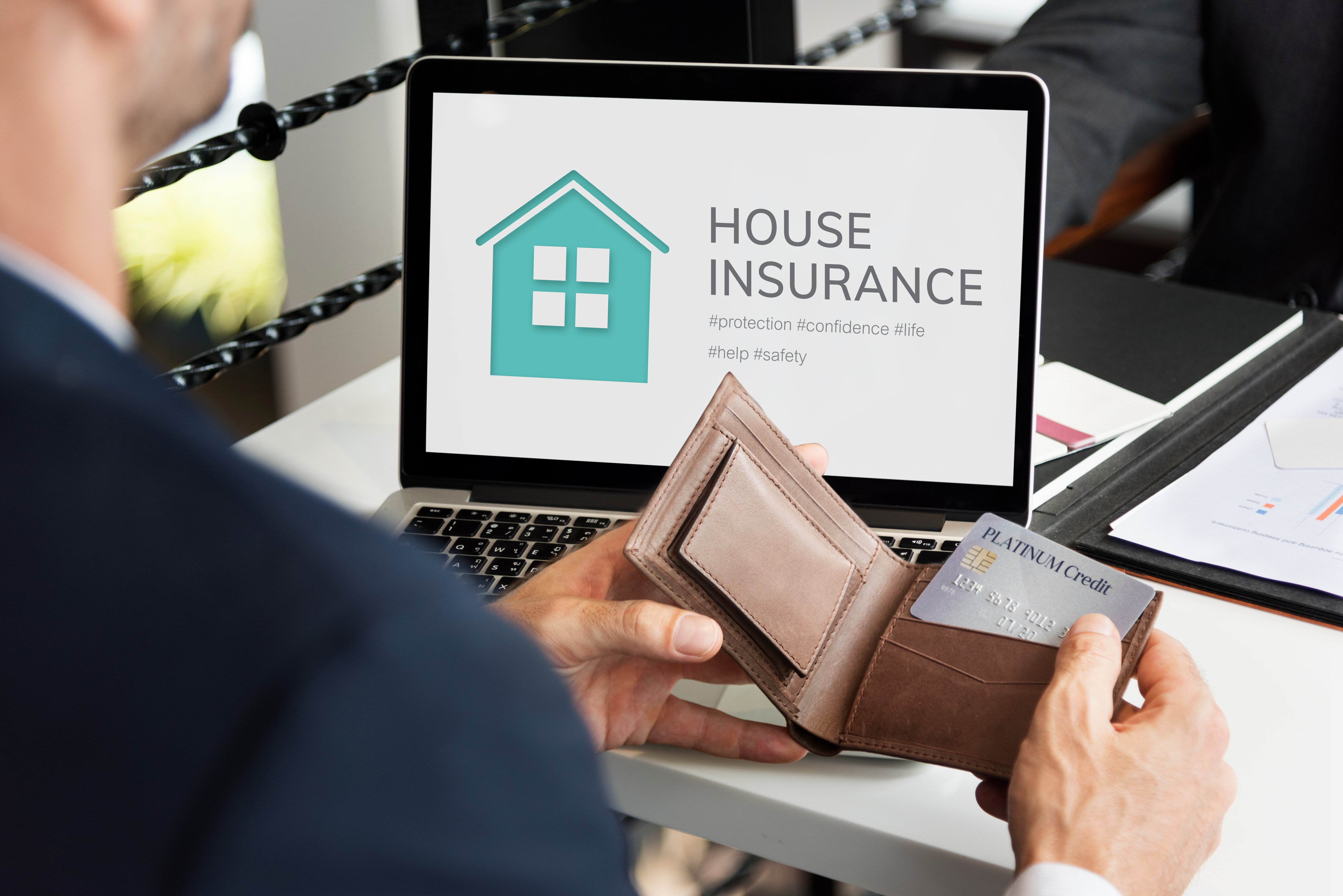 businessman-on-house-insurance